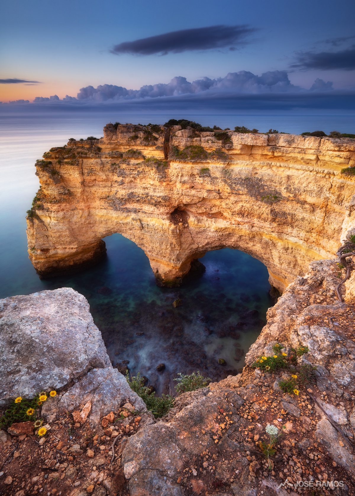 Landscape photo shot during sunrise in Marinha Beach, Algarve, Portugal, showing a heart shape hidden in the cliffs